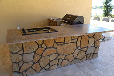 Backyard kitchen with gas grill in Wisconsin